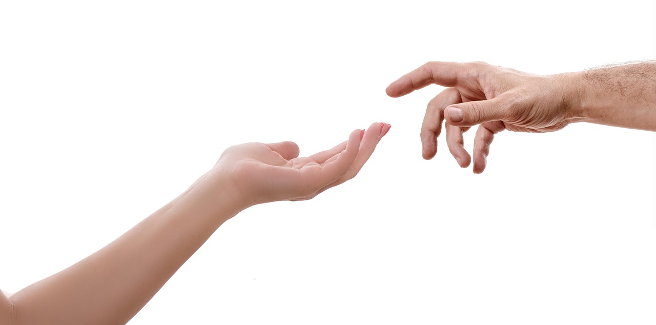 About Us Hand reaching in support gesture