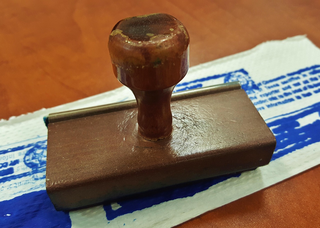 Supporting-you-in-achieving-sec-IMG.jpg stamp, rubber stamp, stamped, ink, ink pad, notary, notarize, notarized, imprint, office, office supplies, desk, brown office, brown desk, notary, notary, notary, notary, notary