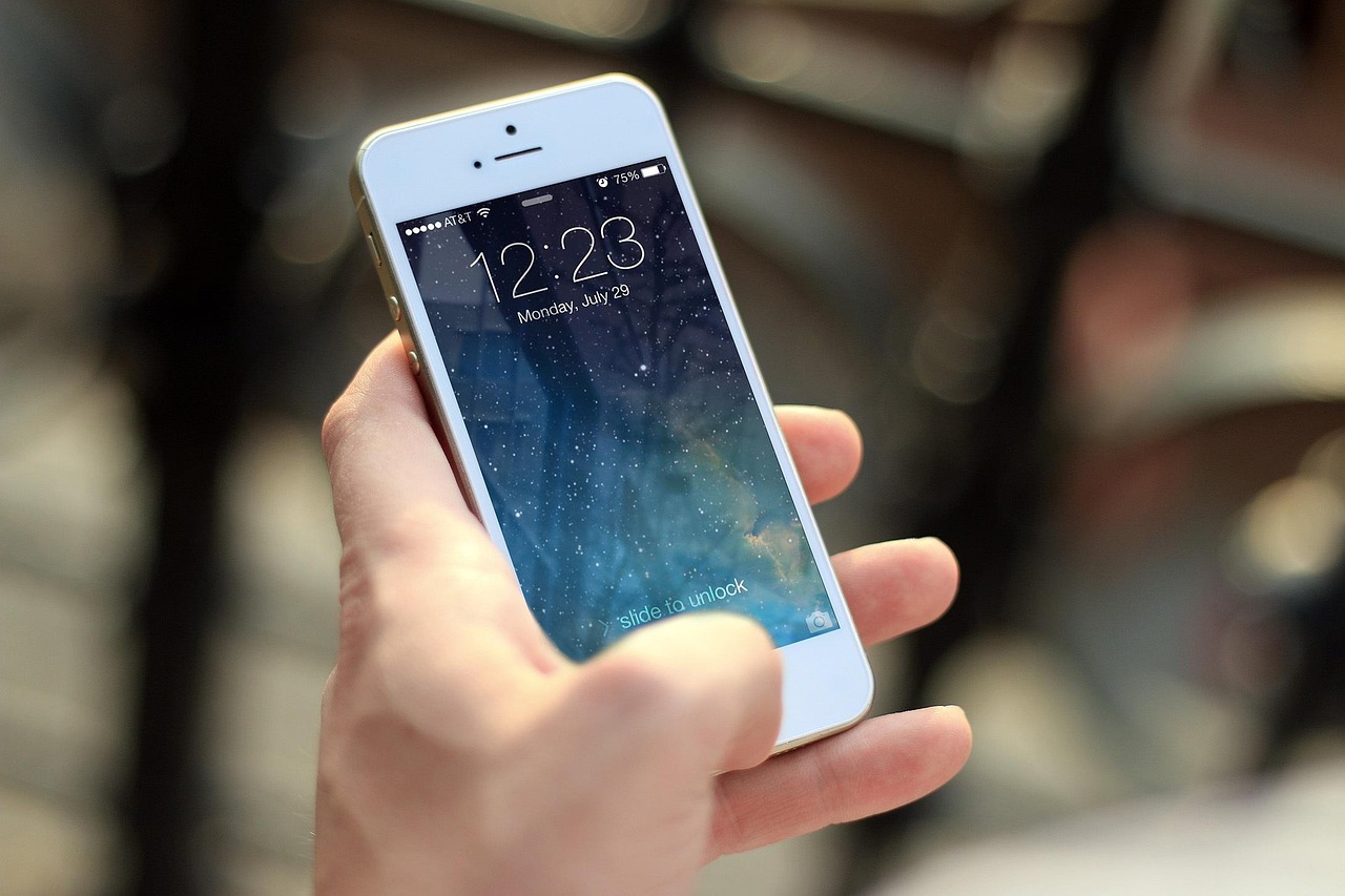 Services Person holding smartphone with apps