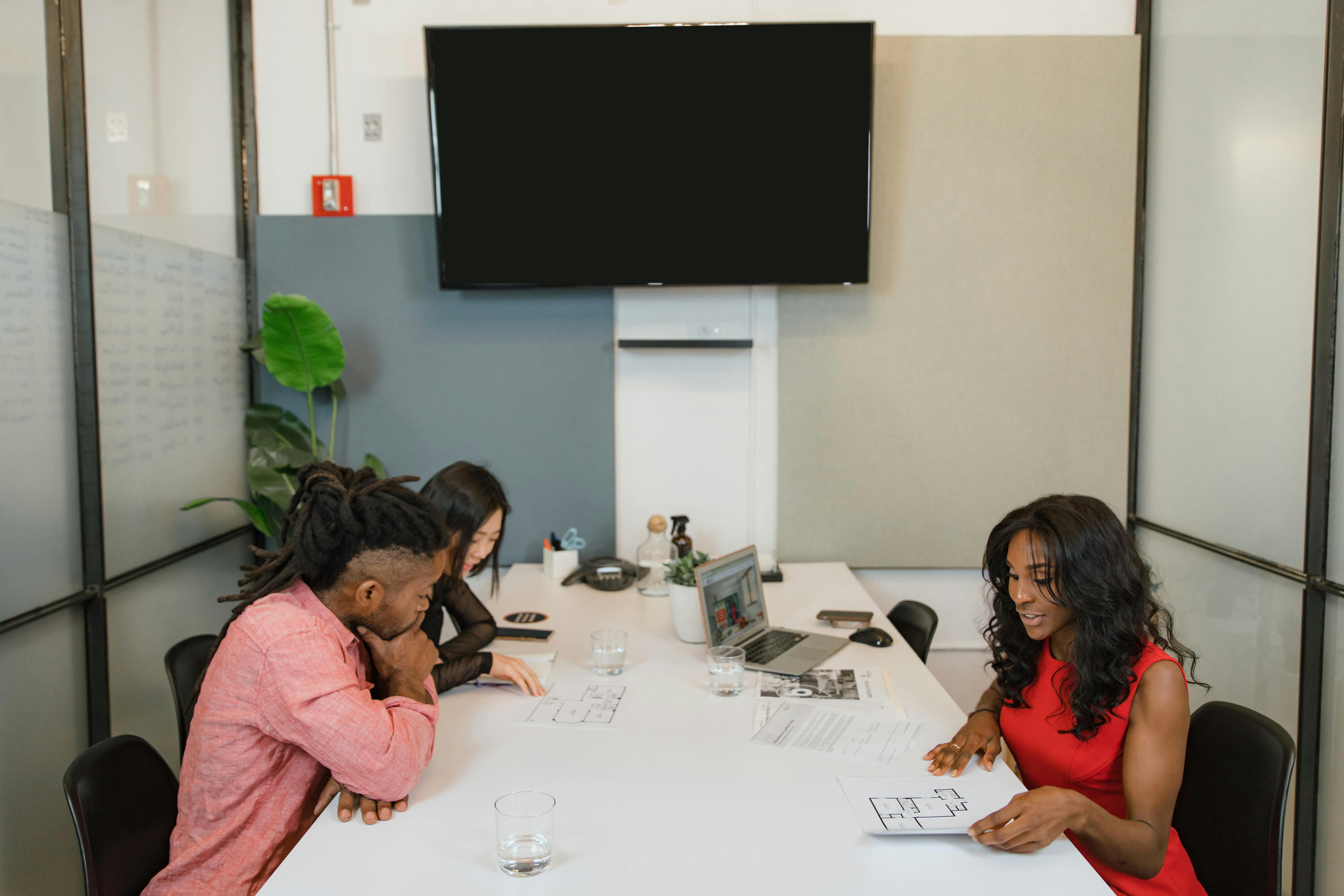 Business professionals having a meeting in a modern office space.