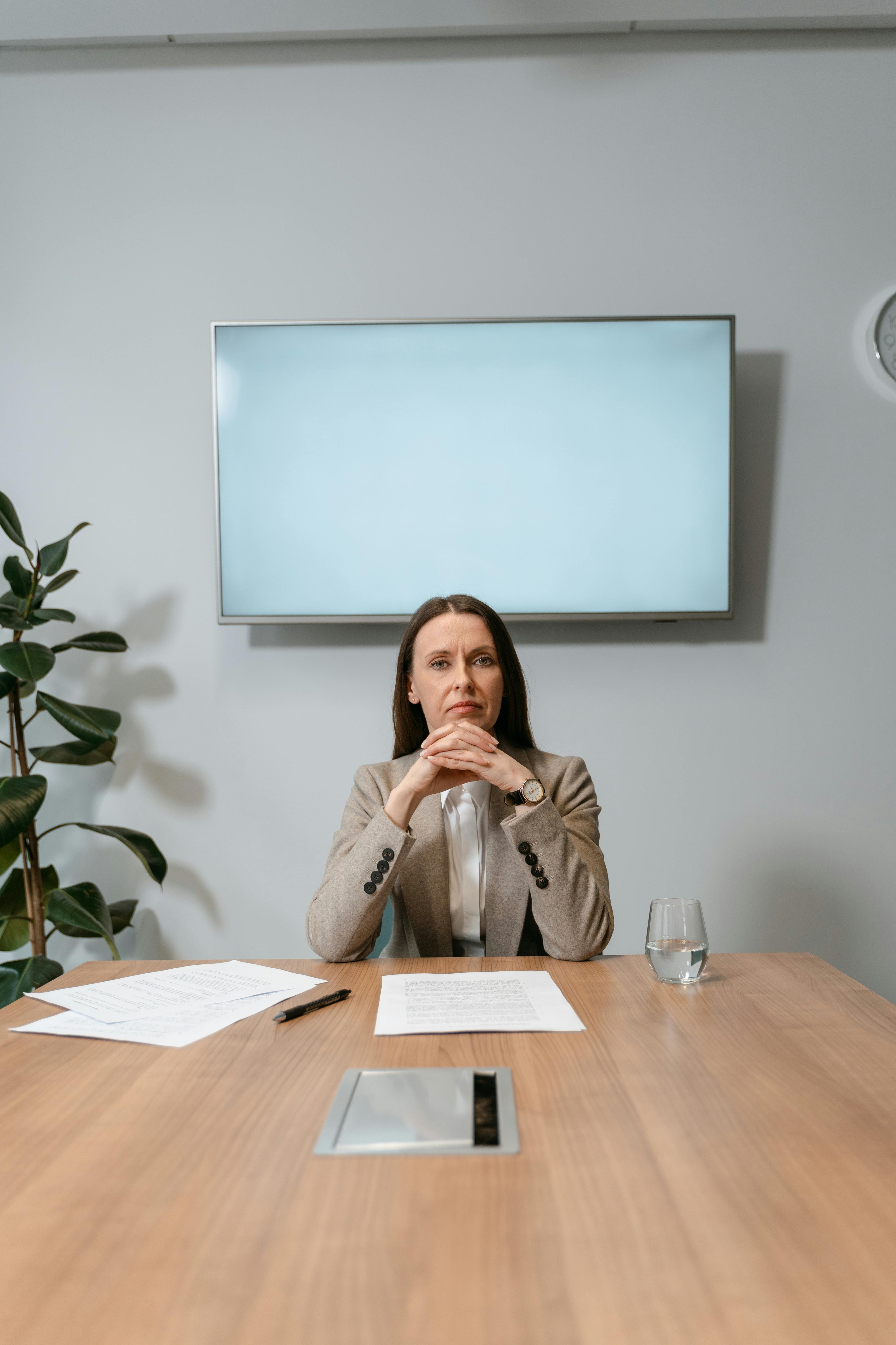 Professional businesswoman sitting confidently at a desk